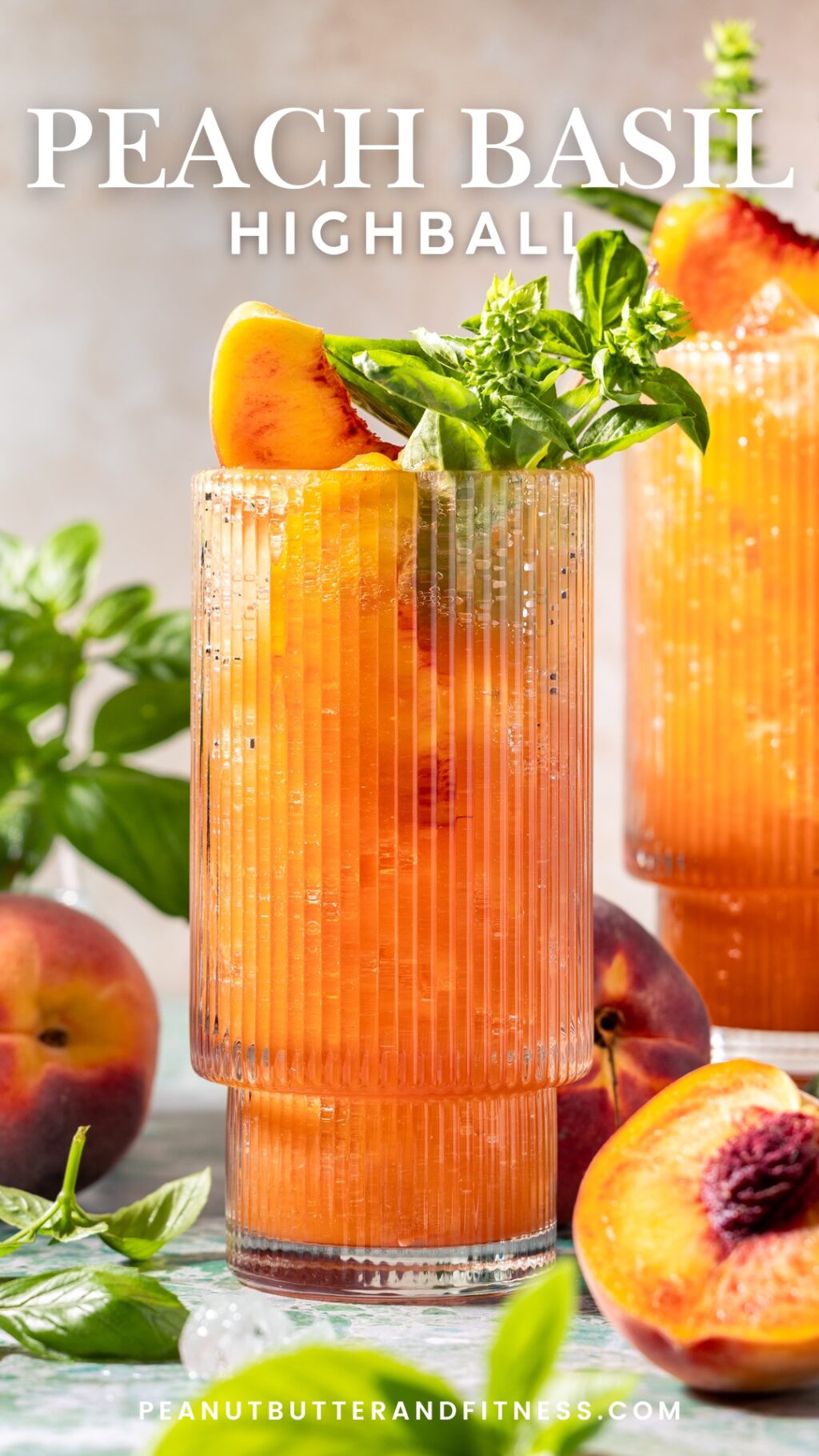 Peach Basil Highball made with bourbon, peaches, honey, lemon juice, and fresh basil. Topped off with sparkling water for a refreshing summer cocktail!