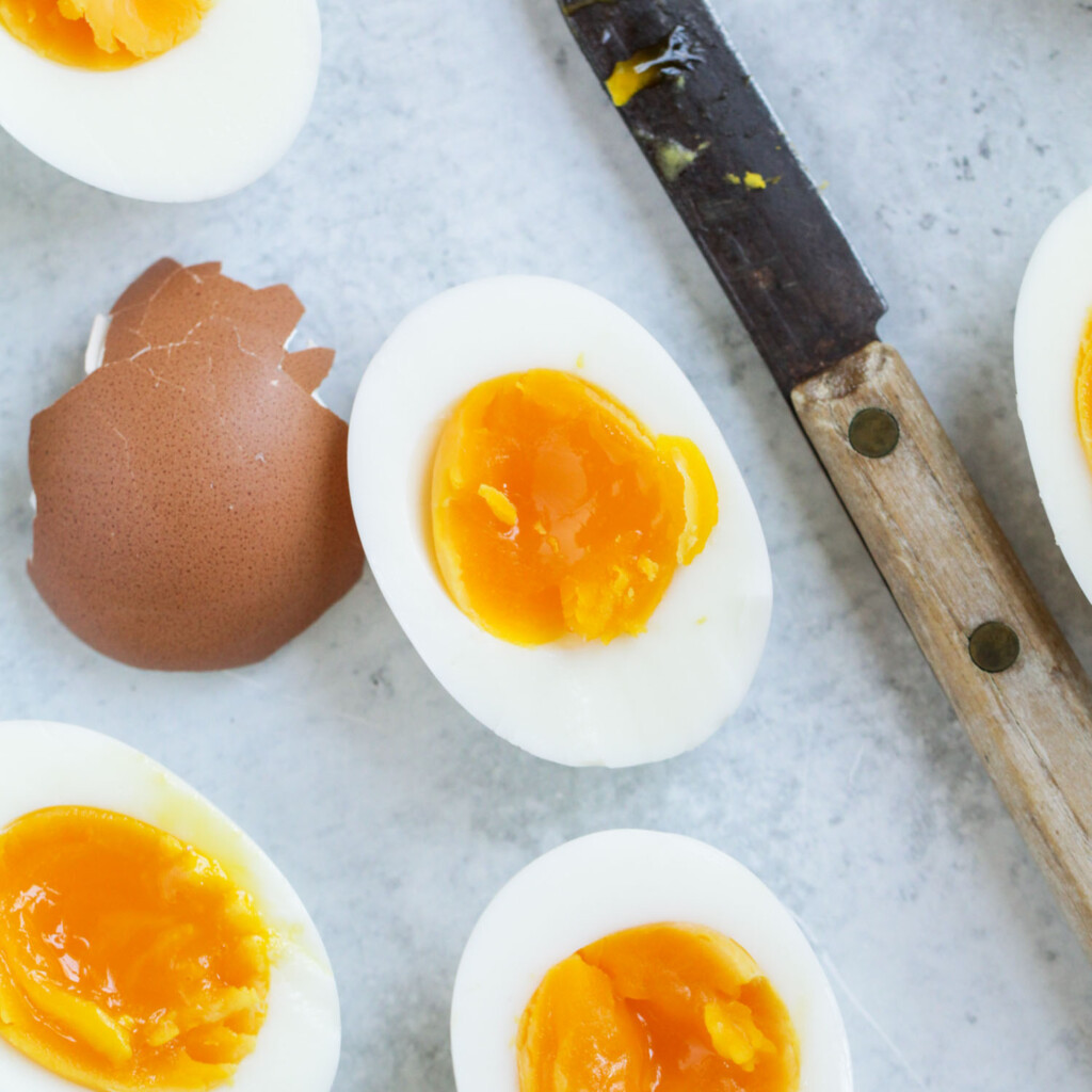 Soft boiled eggs cut in half to reveal the jammy egg yolk.