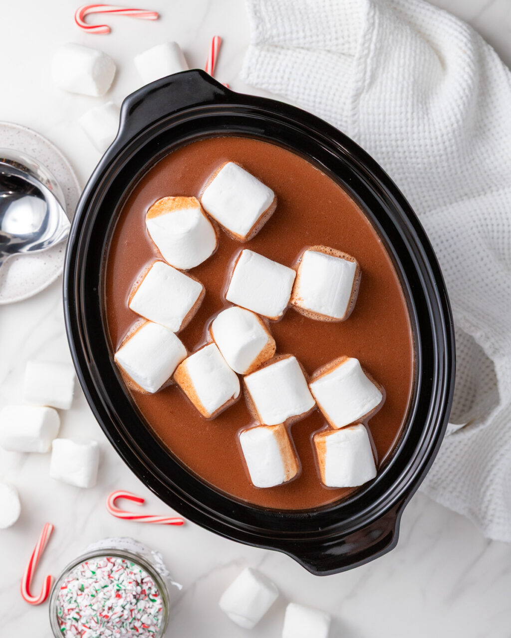 Slow Cooker Peppermint Mocha Hot Chocolate shown in a slow cooker with marshmallows.