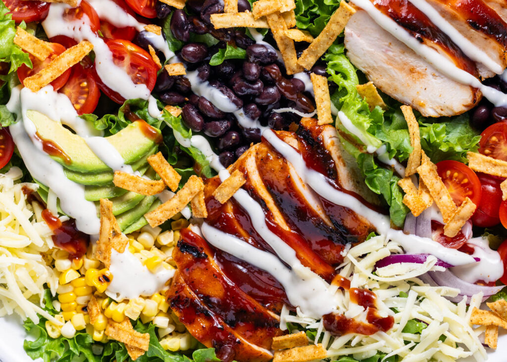 BBQ Ranch Chicken Salad great for summer lunches with the family. Hearty summer salad with 41 grams protein and 7 grams of fiber. High protein, high fiber, and meal prep friendly.