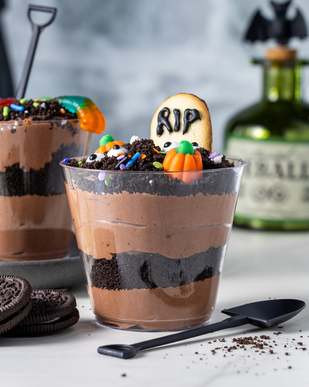 Cottage cheese dirt pudding cup with decorated cookie as a gravestone